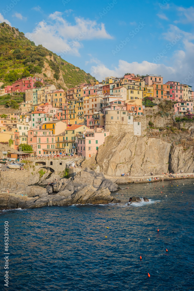 Village of Marola with colorful houses on hill on the Mediterranean Sea, famous Cinque Terre ITALY