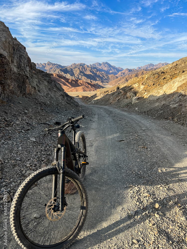 Mountain bicycle parked on the road in Bajda area in Tabuk Mountain bicycle parked on the road in Bajda area in Tabuk