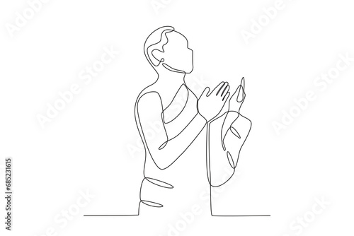 A man praying at the Kaaba. Hajj one-line drawing