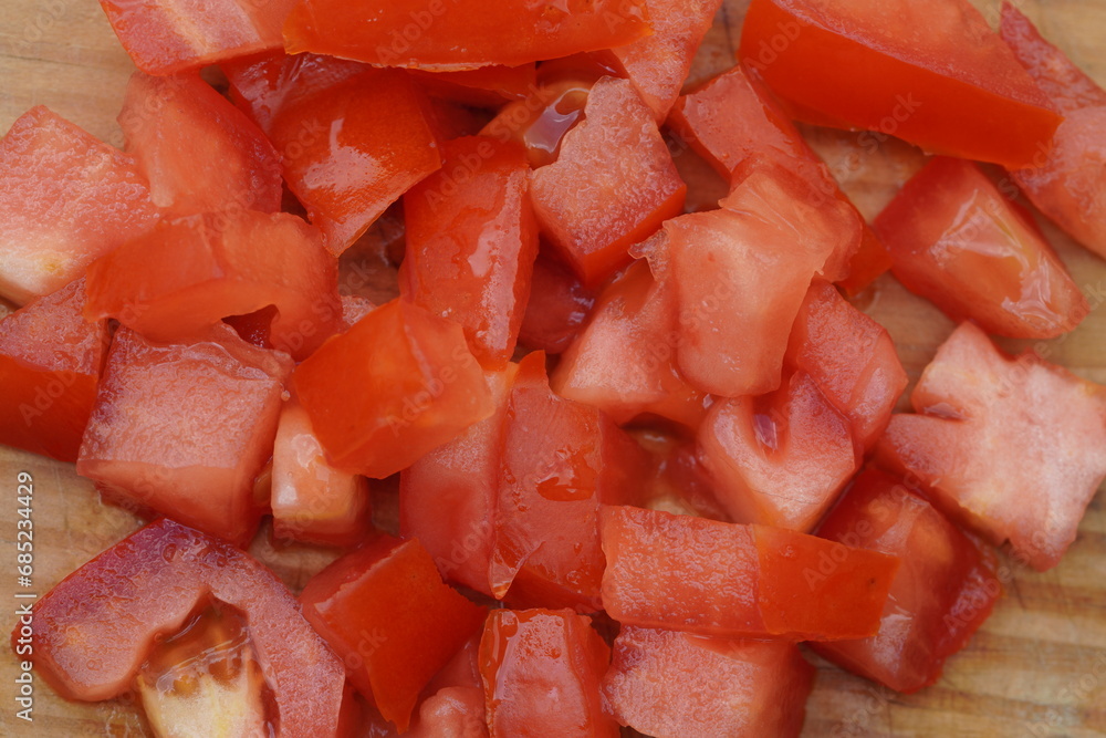 Chopped Tomatoes on chopping board ,close up Chopped Tomatoes on chopping board ,close up