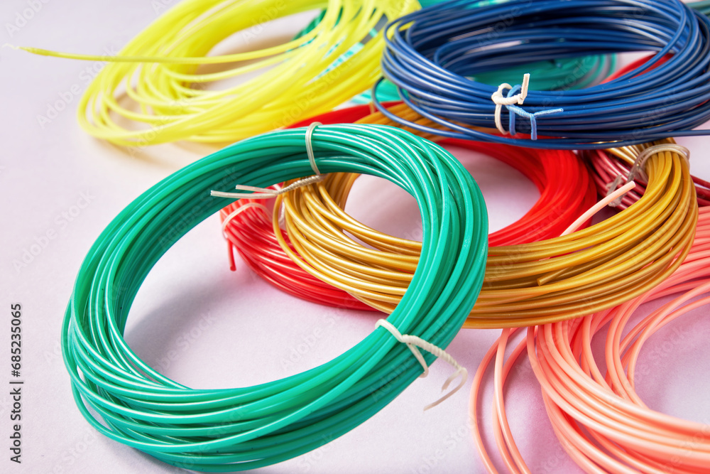 Closeup view of bunch of colorful plastic strings for modern 3D pen. Hobby, toys and craft backgrounds Closeup view of bunch of colorful plastic strings for modern 3D pen. Hobby, toys and craft backgrounds