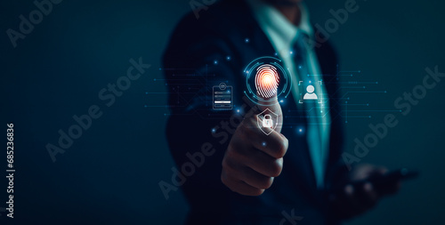 User is scanning fingerprint on virtual screen to verify identity for login, doing transactions on internet online, concept of secure technology security Cyber ​​privacy protection photo