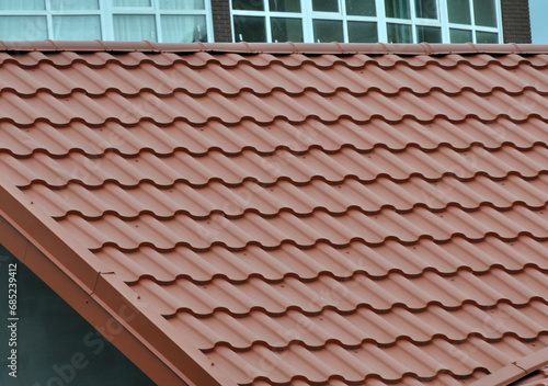 The roof of the house is covered with metal tiles
