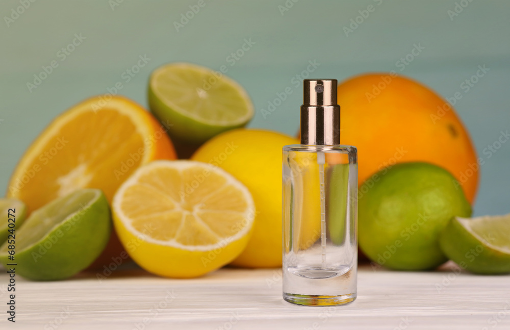 Perfume with citrus extracts. Selective focus. Spa day, concept of freshness perfume bottle with lemon lime and orange slices Perfume with citrus extracts. Selective focus. Spa day, concept of freshness perfume bottle with lemon lime and orange slices