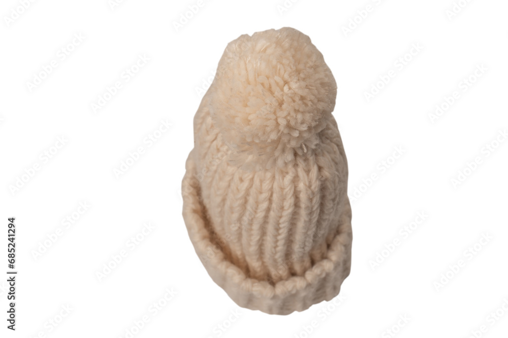 Beige beanie hat with pom pom isolated on a white background. Beige beanie hat with pom pom isolated on a white background.