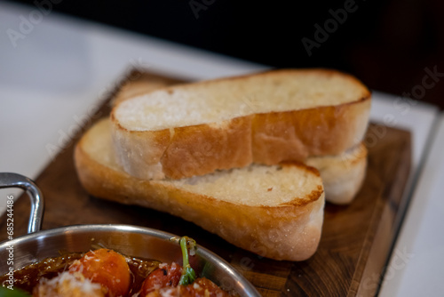 Sliced bread prepared to eat with Tapas, an appetizer or snack in Spanish cuisine