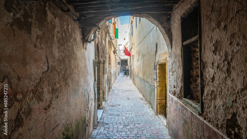 A historic narrow road in medina district of Essaouira old town, Morocco © CanYalicn