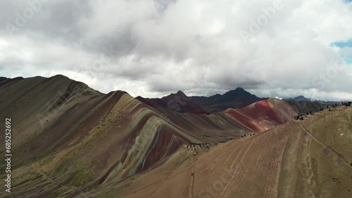 Drone view of Rainbow Mountain, officially Vinicunca, outsize Cuzco, Peru on a cloudy day
