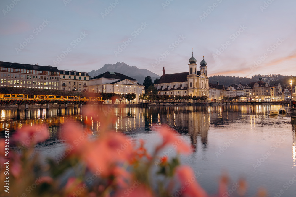 The Chapel bridge and the Jesuit Church of Lucern with Mount Pilatus in the background, Central Switzerland, tourism in Europe