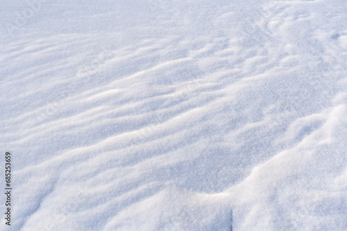 Winter background with snowy ground. Natural snow texture.