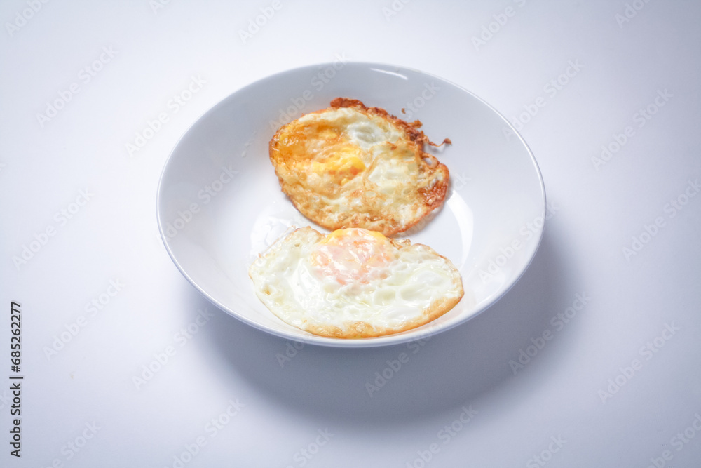 Fried egg with bread on white background. Thai style breakfast. Fried egg with bread on white background. Thai style breakfast.