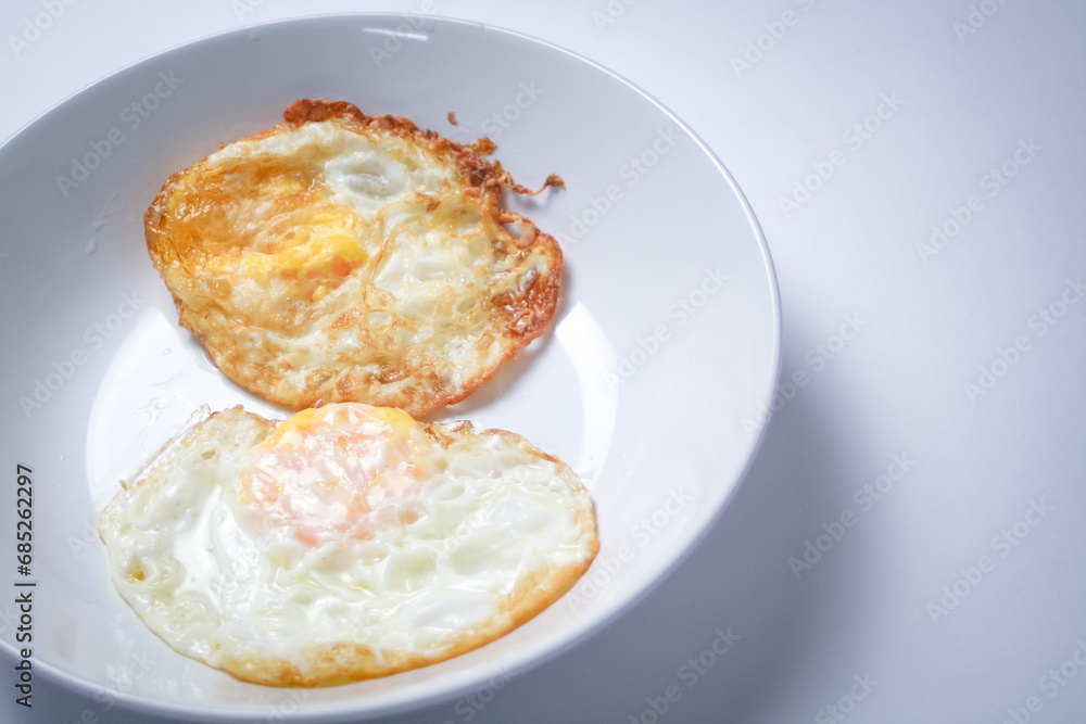 Fried egg with bread on white background. Thai style breakfast. Fried egg with bread on white background. Thai style breakfast.