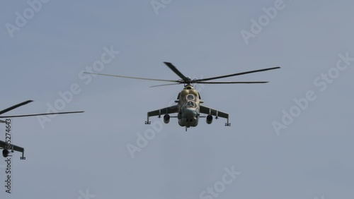 Wallpaper Mural Military helicopters flying in sky performing demonstration flight, airforce, copy space. Group combat helicopters, aerobatic team performs flight at air show Torontodigital.ca