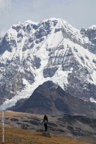 panoramic view of a man in front of a large snowy mountain, Ausangate