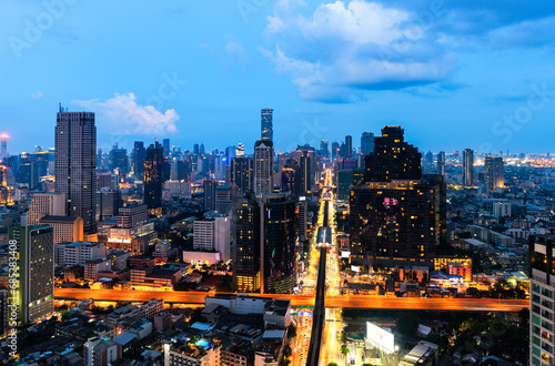 Aerial City view of Bangkok city and subway station Thailand Bangkok skyline and skyscraper with light trails on Sathorn Road center of business in Bangkok downtown. Bangkok Thailand