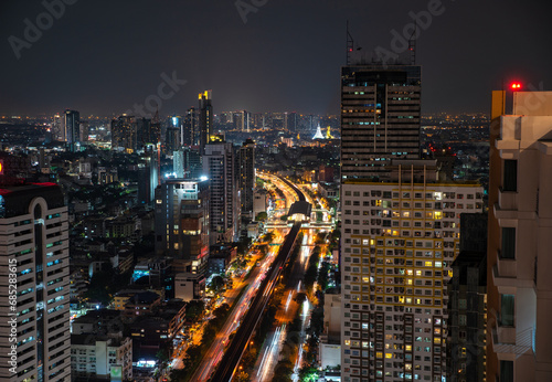 Aerial City view of Bangkok city and subway station Thailand Bangkok skyline and skyscraper with light trails on Sathorn Road center of business in Bangkok downtown.  Bangkok Thailand