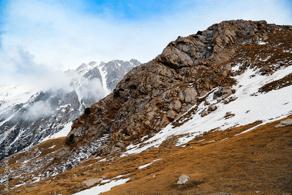 Seok Pass or Suyak Pass (Pereval Suyek) is a mountain pass in the Terskey Ala-Too Mountain Range, Issyk-Kul Lake, Karakol, Kyrgyzstan. Tian-Shan. Famous Asian tourist destination. Dry grass.