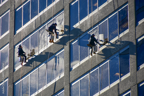 Window washers work high above the streets of Rosslyn, Virginia. © Tim