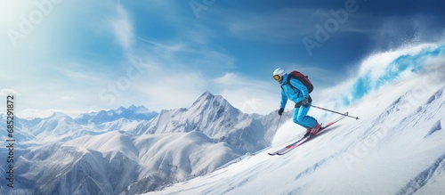 Skier on sunny mountain slo...
