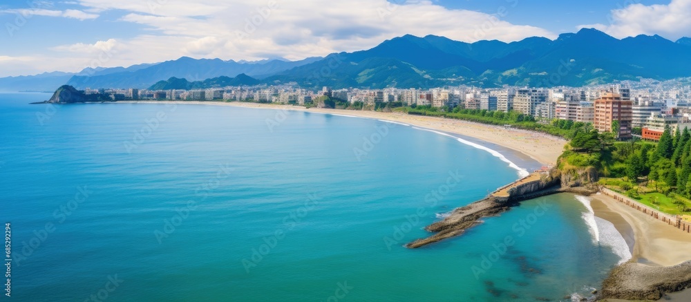 Taiwan summer beach vacation Aerial view of colorful beach Drone captures Dawulun Beach Aodi Fishing Harbor Keelung City Taiwan copy space image