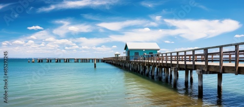 The Urangan pier in Hervey Bay Australia has public fish cleaning facilities and is popular among locals for fishing copy space image photo