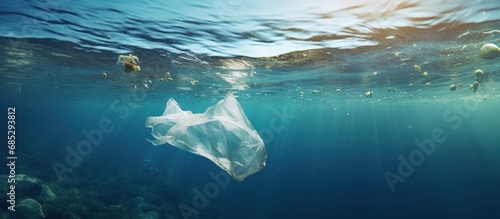 Plastic bags in the ocean cause an environmental crisis copy space image photo