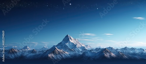 Stunning moonlit mountain peak amidst serene snowy landscape copy space image