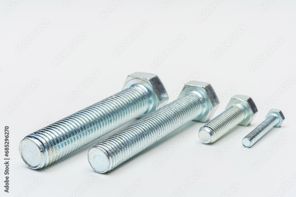 iron bolt on a white background. metal bolt on a light background. photos of a threaded bolt for the catalog iron bolt on a white background. metal bolt on a light background. photos of a threaded bolt for the catalog