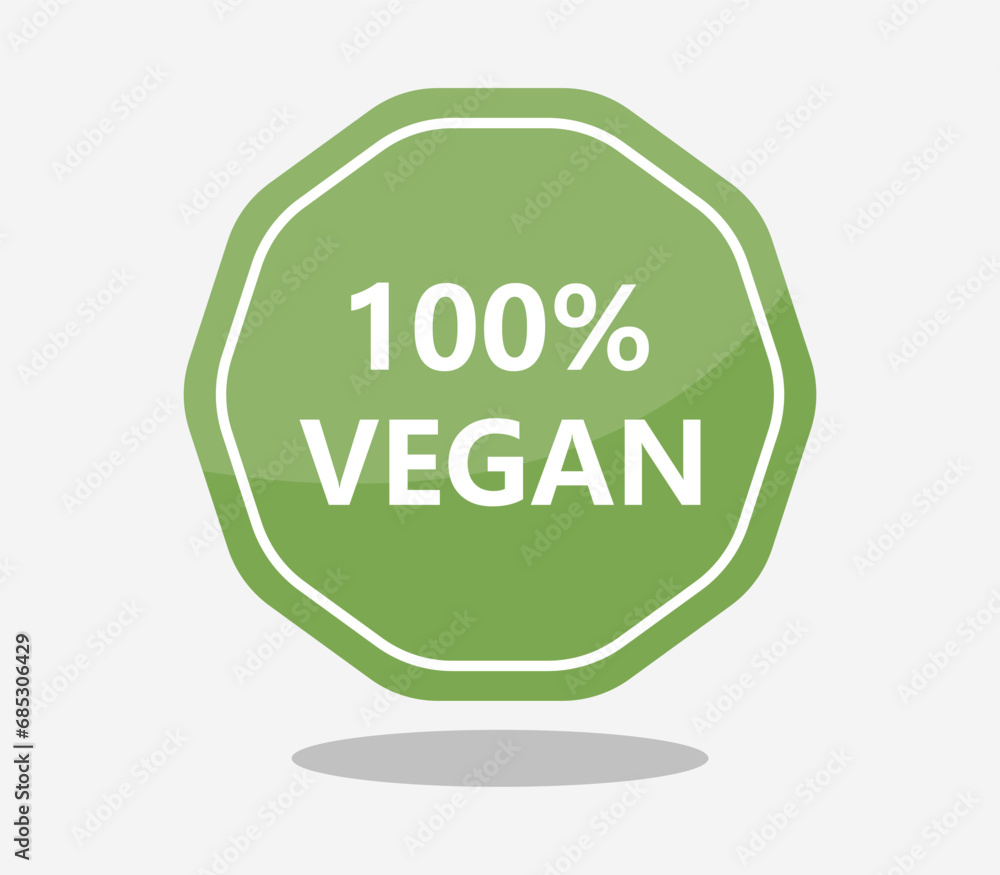 a green sign with the words vegan on it, and a small white object a green sign with the words vegan on it, and a small white object