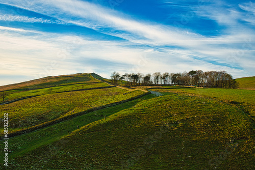 Beautiful landscape photo of the blue sky and nature at Sycamore Gap, UK