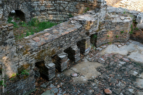 Ruins of the Great Basilica in Butrint National Park, Buthrotum, Albania. Triconch Palace at Butrint Life and death of an ancient Roman house Historical medieval Venetian Tower surrounded photo