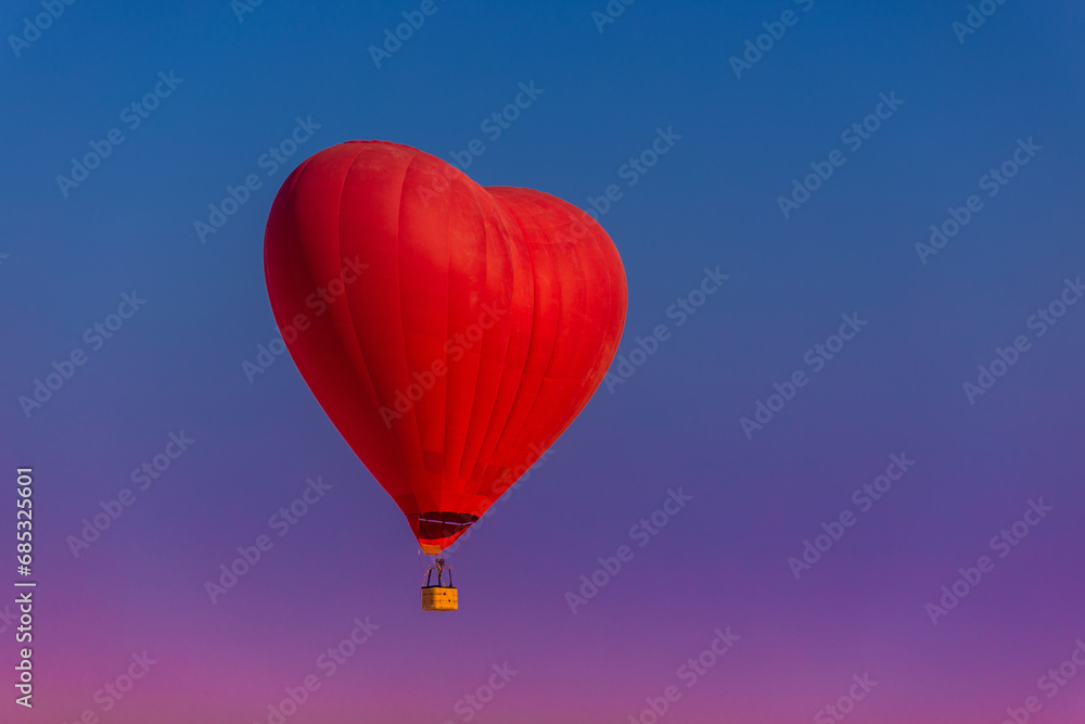 Fototapeta premium Postcard mockup with copyspace for Valentine's Day with a balloon in the shape of a red heart.