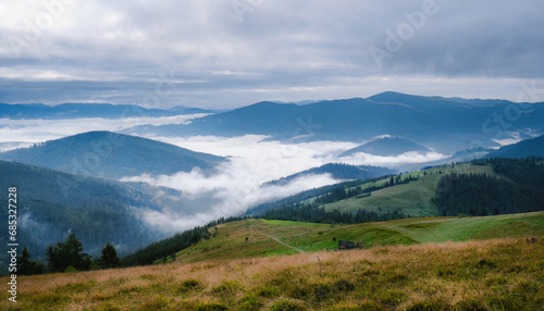 impressivee nature landscape amazing countryside landscape with valley in fog behind the grassy hills picture of wild area awesome nature background carpathian mountains ukraine