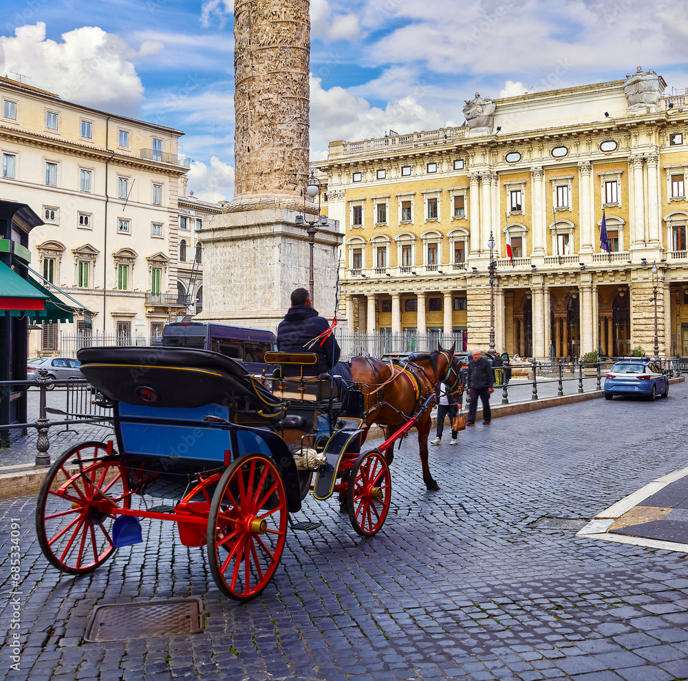 Obraz premium Rome, Italy. Horses in harness with coach for entertaining touristic strolls and city tours at Piazza Colonna (Rione of Column Marcus Aurelius, ancient roman column the Rome center