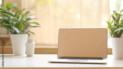 Laptop with blank screen on table.