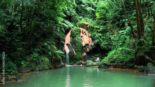 Thermal water at the 'Centro de Interpretação Ambiental da Caldeira Velha' in the middle of the nature, in Azores, Portugal photo