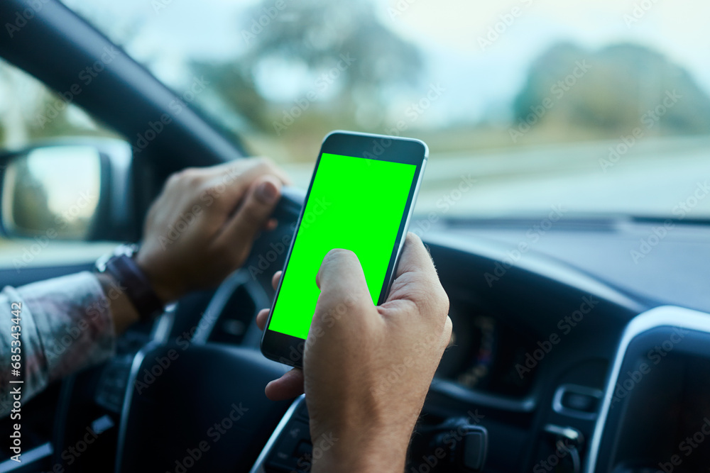 Close up man hands using smartphone at wheel during drive on freeway