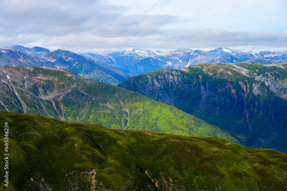 Fototapeta premium Aerial view of the snow-capped mountain summits east of Juneau, Alaska