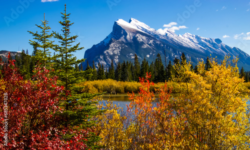 A scenic view of Rundle mountain in Banff National park on a sunny fall day. photo