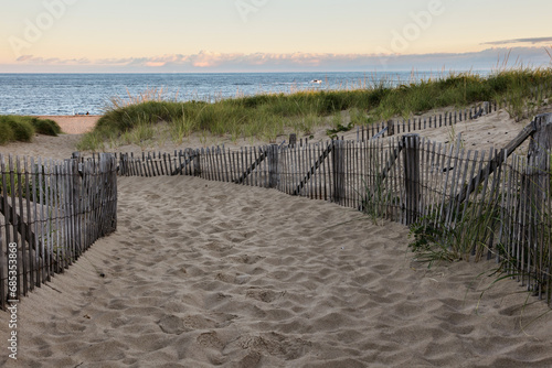 Fototapeta Naklejka Na Ścianę i Meble -  Wooden fence with Atlantifc ocean early morning