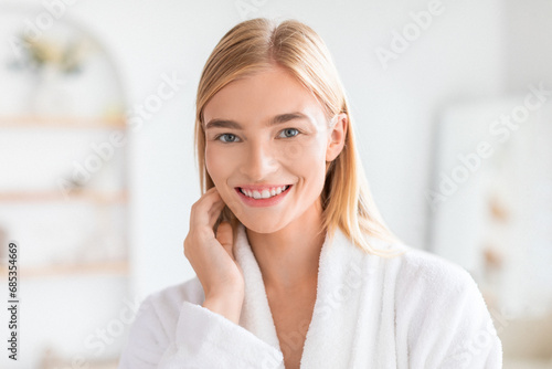 Free Download Blonde woman gently touches her face in bathroom - GFXLoad
