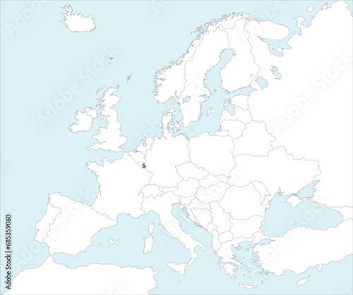 Gray CMYK national map of LUXEMBOURG inside detailed white blank political map of European continent on blue background using Mollweide projection