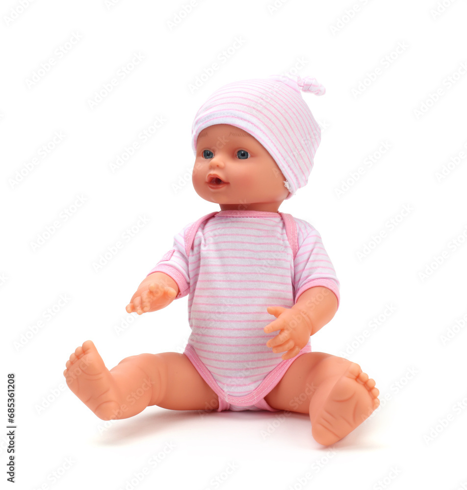 Toy baby doll in pink clothes and hat on white. Toy baby doll in pink clothes and hat on white.