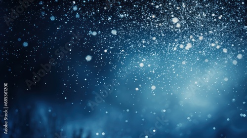  a blurry photo of snow flakes on a dark blue background with a white spot on the right side of the image.