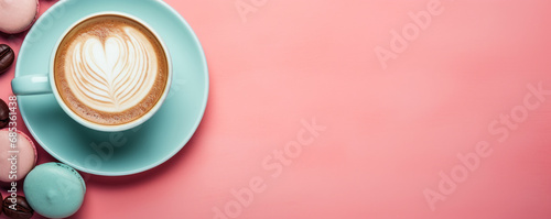 Macaroons cakes and cup of coffee creative layout on colorful background