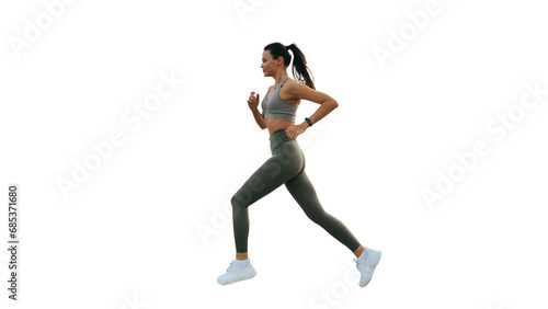 beautiful slender brunette, sportswear and a fitness bracelet runs against transparent background, develops  endurance. Asian young woman doing an outdoor workout. Active people, healthy lifestyle