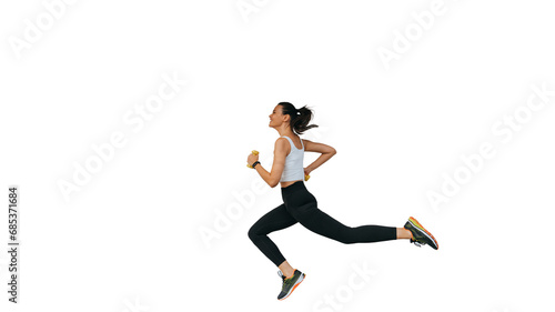 Cheerful young fit woman in sportswear running against transparent background. Focused female runner preparing for Olympics. Pro sport, endurance. Brunette multiethnic girl running, active people.