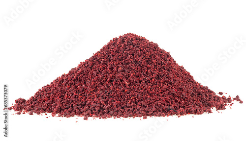 Ground sumac spice pile isolated on a white background. Dried ground red sumac powder. photo
