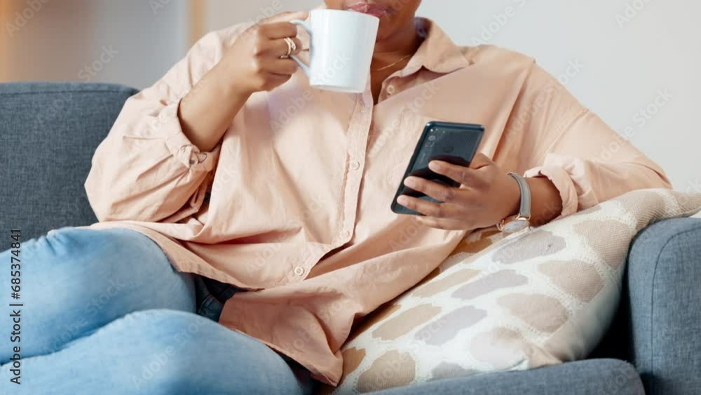 Woman reading a phone with funny memes on social media, drinking coffee and relaxing on sofa. Closeup of happy black female catching up with latest trends while browsing the internet and chatting Woman reading a phone with funny memes on social media, drinking coffee and relaxing on sofa. Closeup of happy black female catching up with latest trends while browsing the internet and chatting