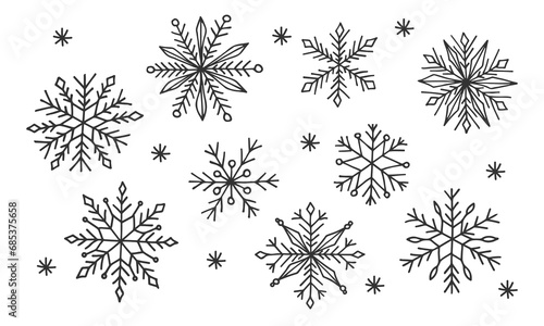 Doodle hand drawn snowflakes set. Black line drawn cute silhouette snowflake isolated on white. Element for winter design